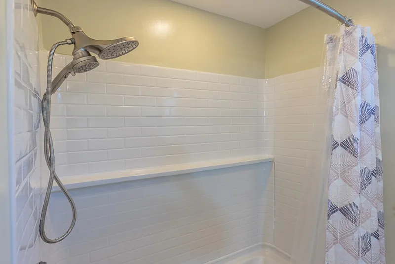 Dual Head Shower with Tiled Surround and Tub — Authentic 3BR Duplex, Wailuku