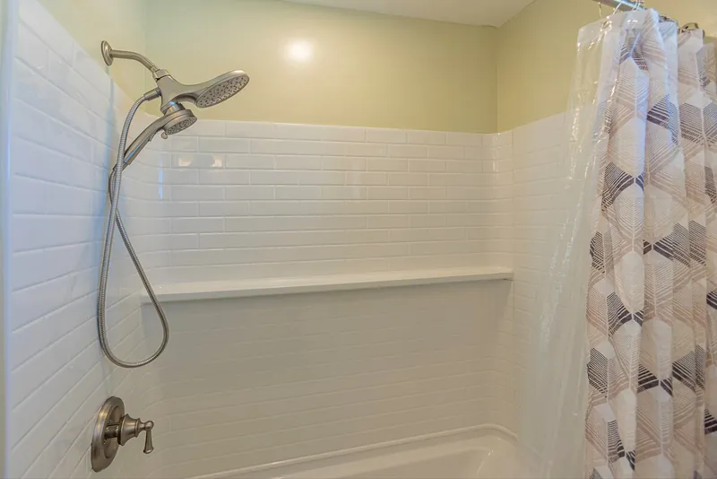 Dual Head Shower with Tiled Surround and Tub — Modern 3BR Home, Wailuku